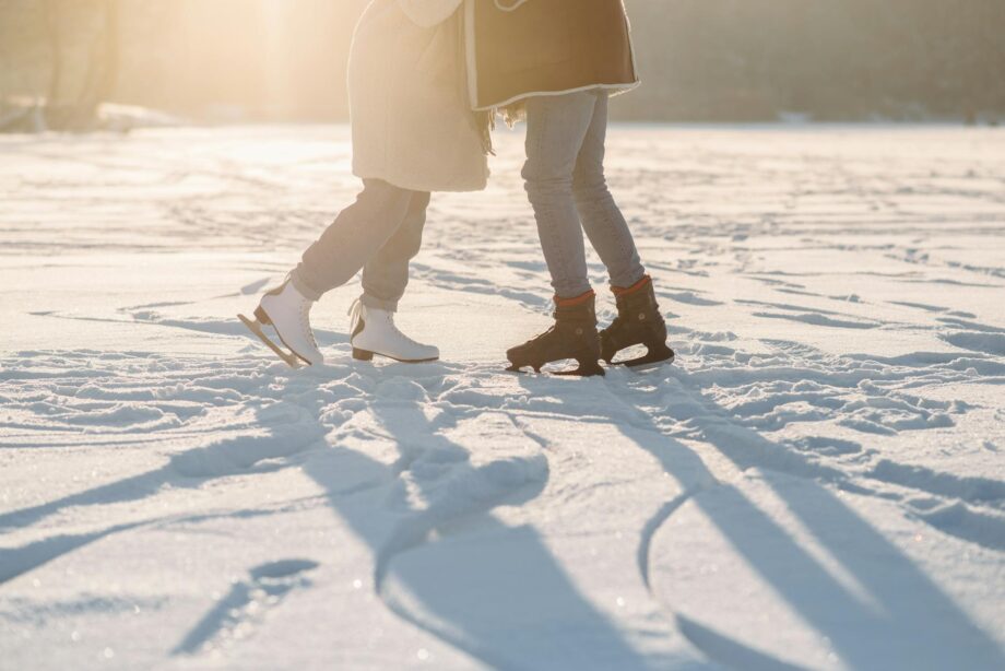 people standing wearing ice skating shoes